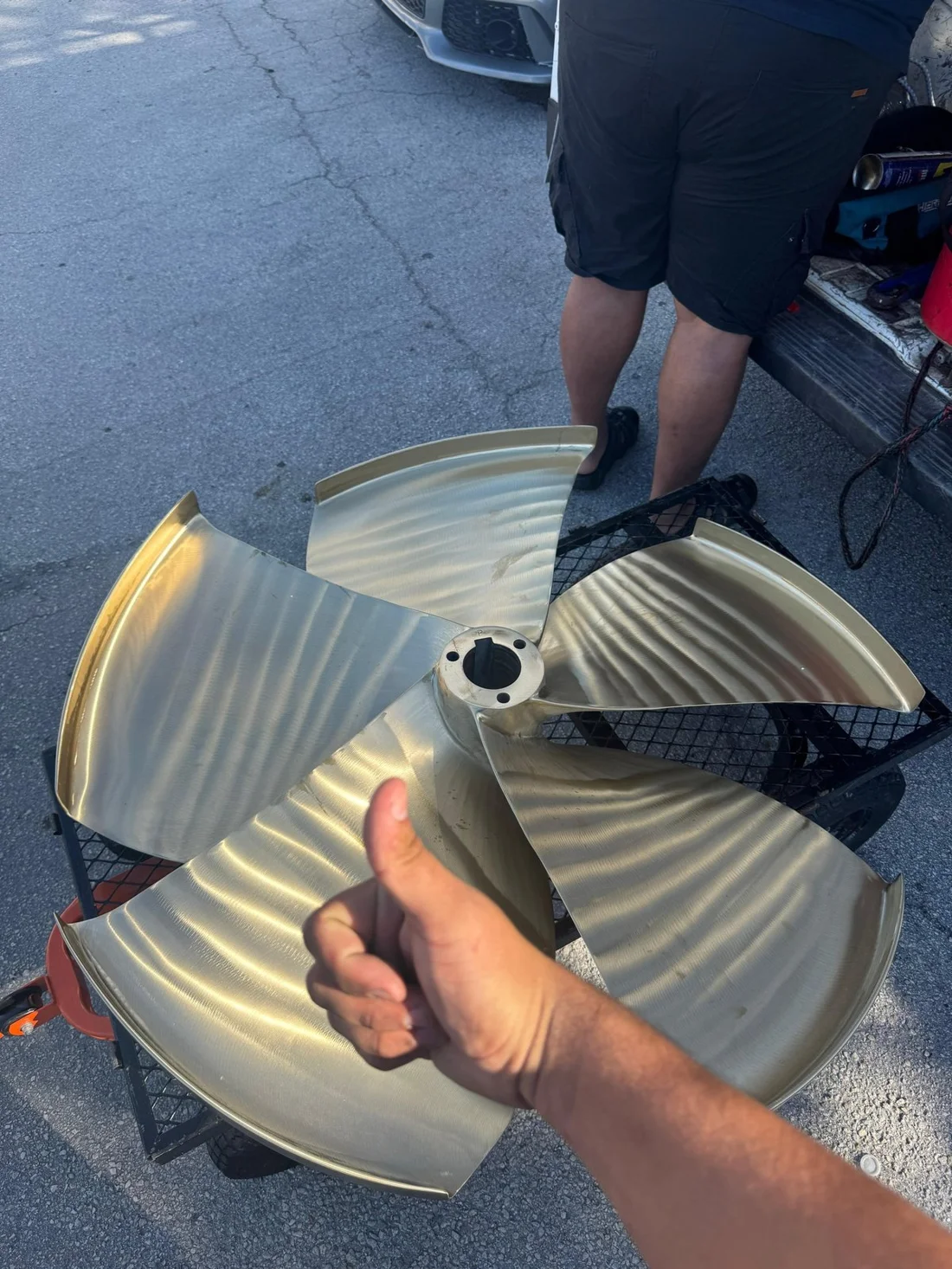A team member with a finished propeller