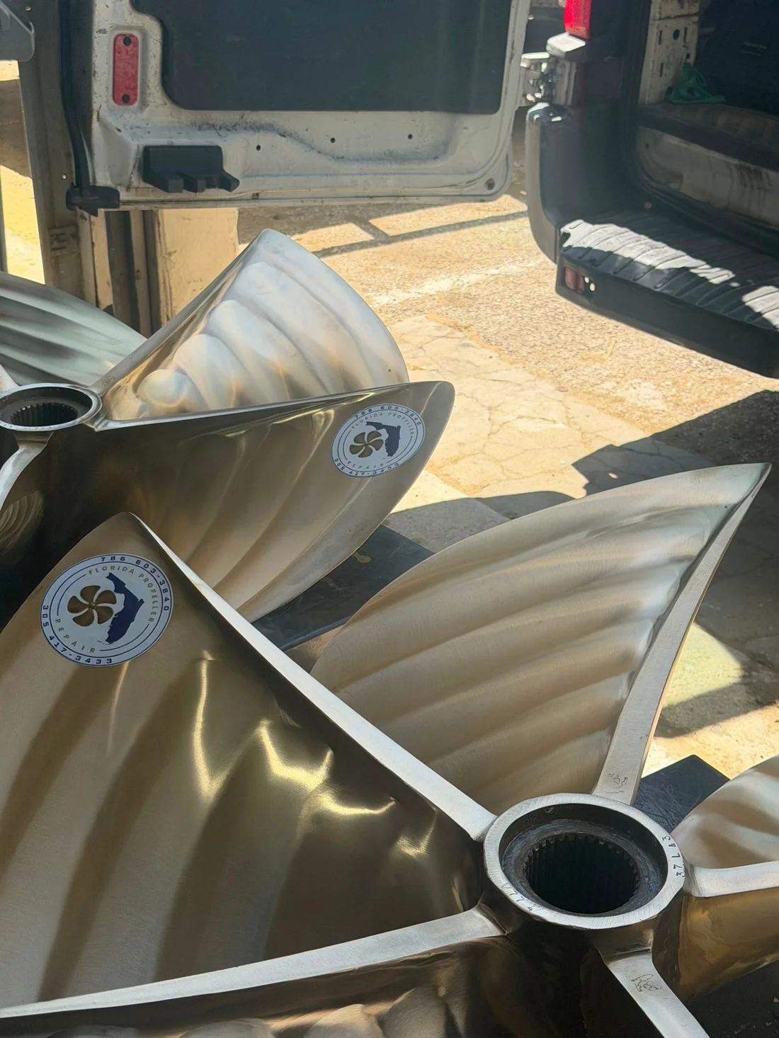 Reconditioned propellers with Florida Propeller Repair branding